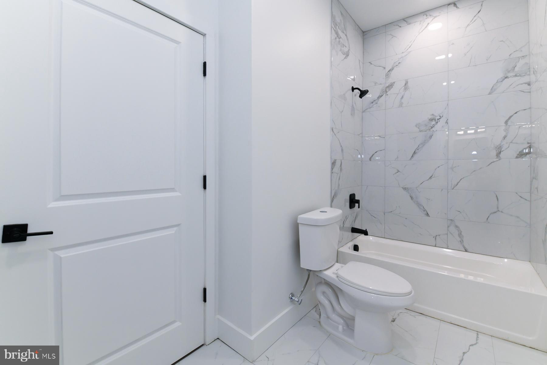 100 Aura Road, Unit 110 Clayton, NJ 08312 - Photo 16 of 21 a bathroom with a toilet and shower