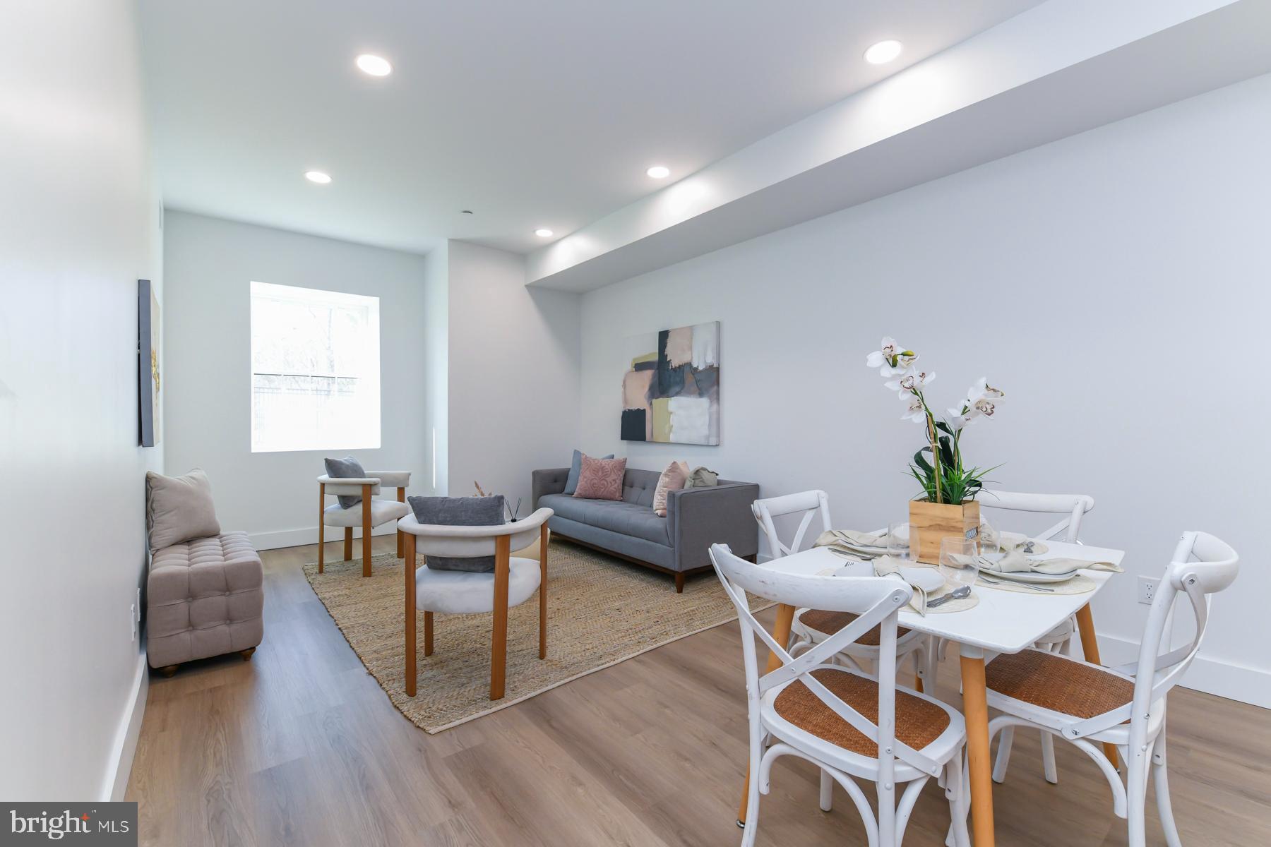 100 Aura Road, Unit 110 Clayton, NJ 08312 - Photo 9 of 21 a dining room with furniture and wooden floor