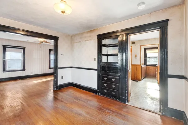 a kitchen with a stove and a cabinet
