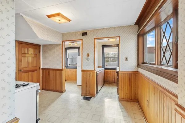 a kitchen with stainless steel appliances granite countertop a refrigerator and a stove