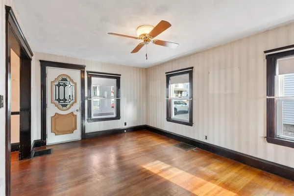a view of livingroom with hardwood floor and a ceiling fan