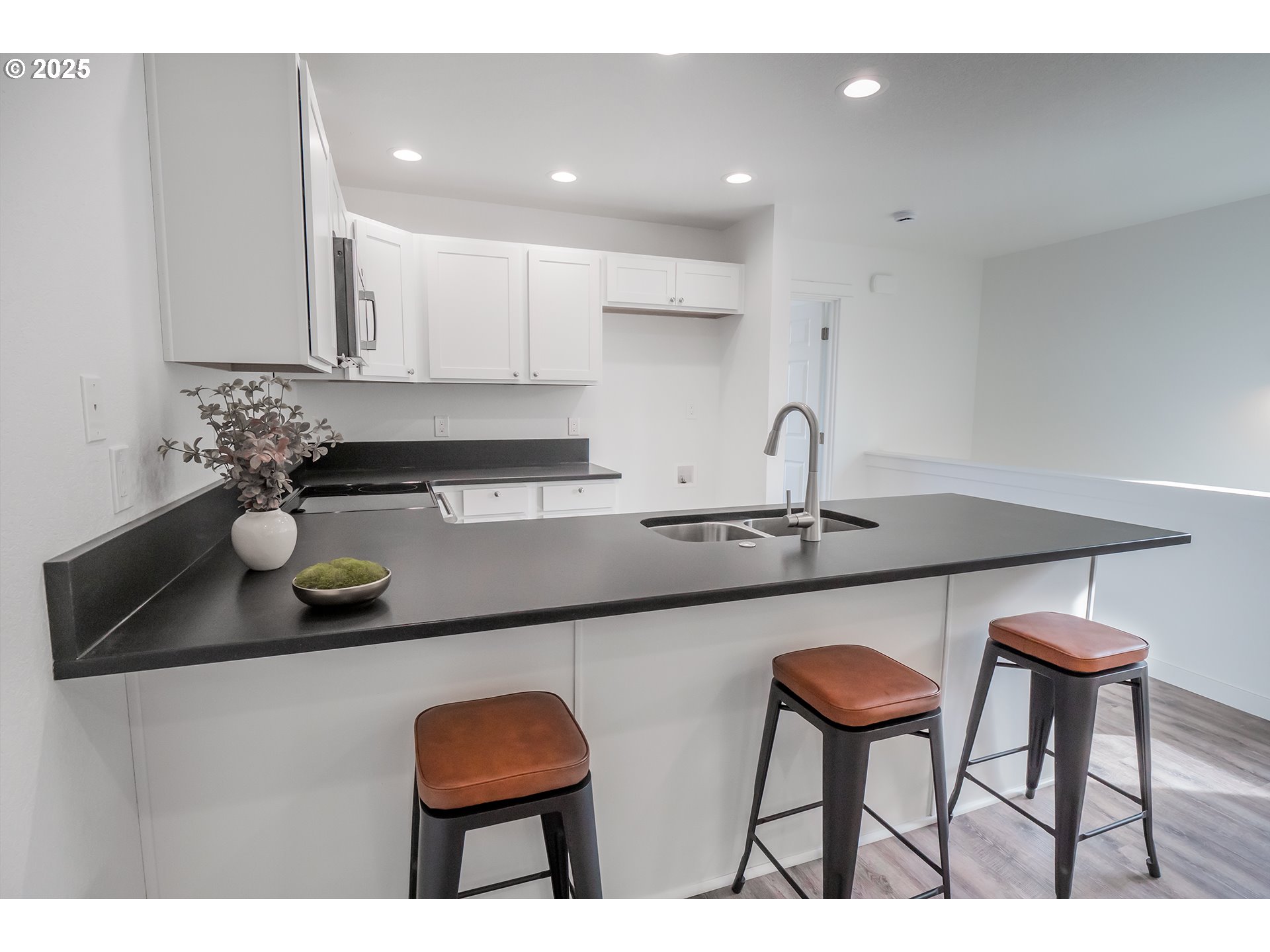 120 65th Place Springfield, OR 97478 - Photo 4 of 45 a kitchen with cabinets a sink and chairs