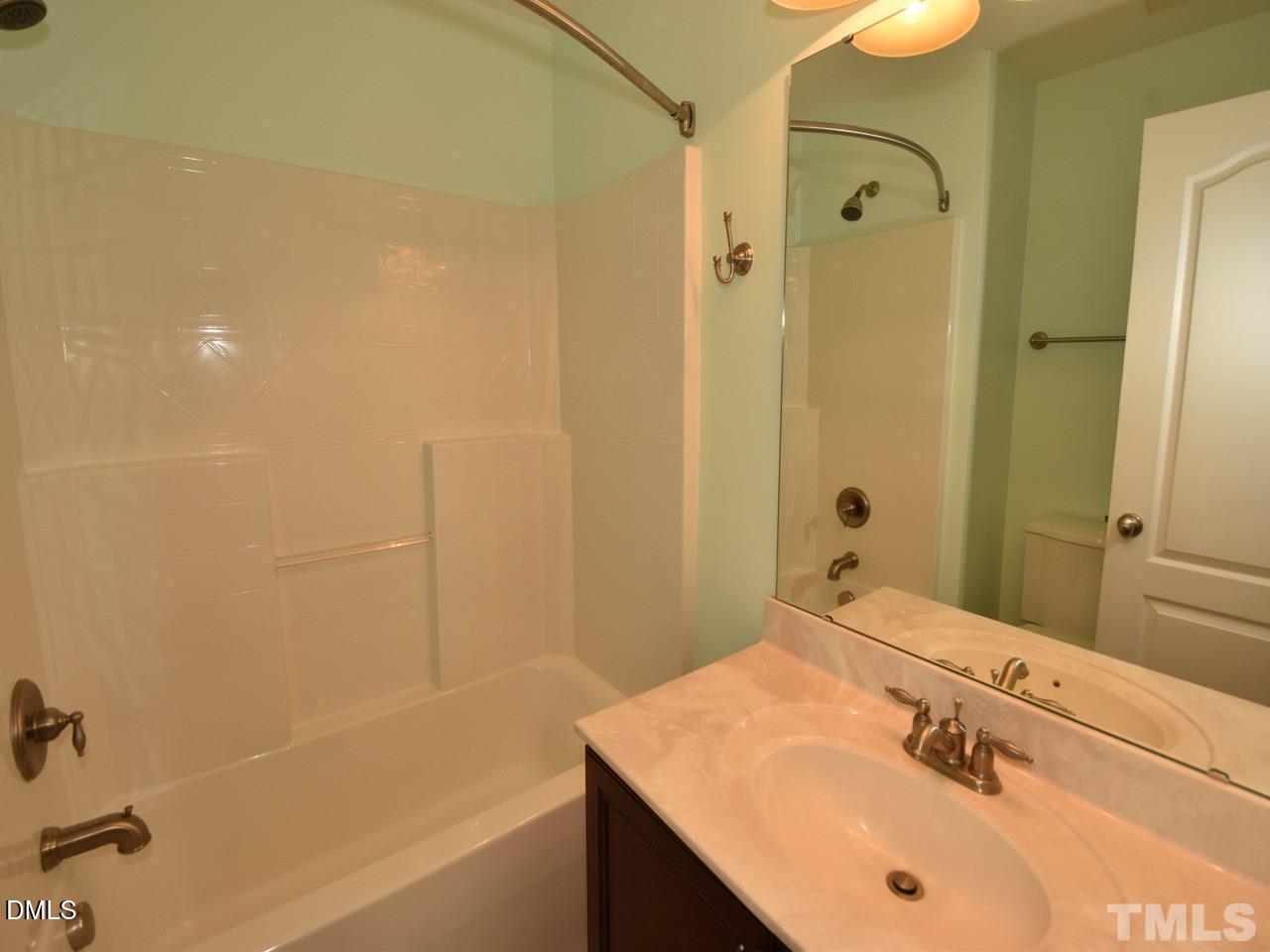 118 Fort Jackson Road Morrisville, NC 27560 - Photo 13 of 21 a bathroom with a sink and a mirror