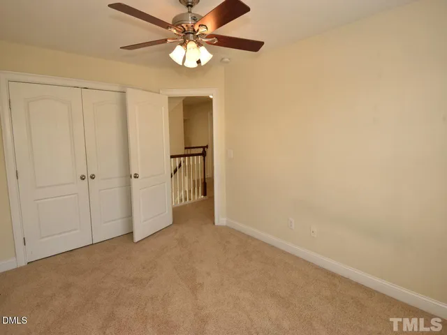 a view of a livingroom with a chandelier fan