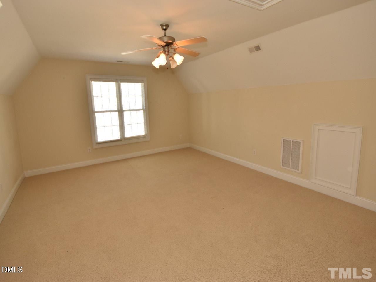 118 Fort Jackson Road Morrisville, NC 27560 - Photo 15 of 21 an empty room with chandelier fan