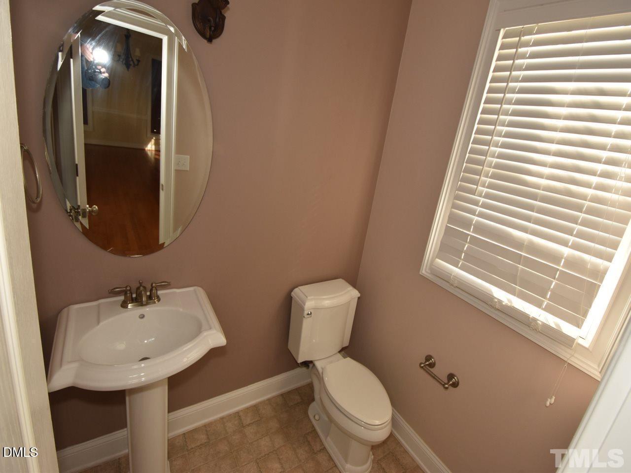 118 Fort Jackson Road Morrisville, NC 27560 - Photo 10 of 21 a bathroom with a toilet sink and mirror