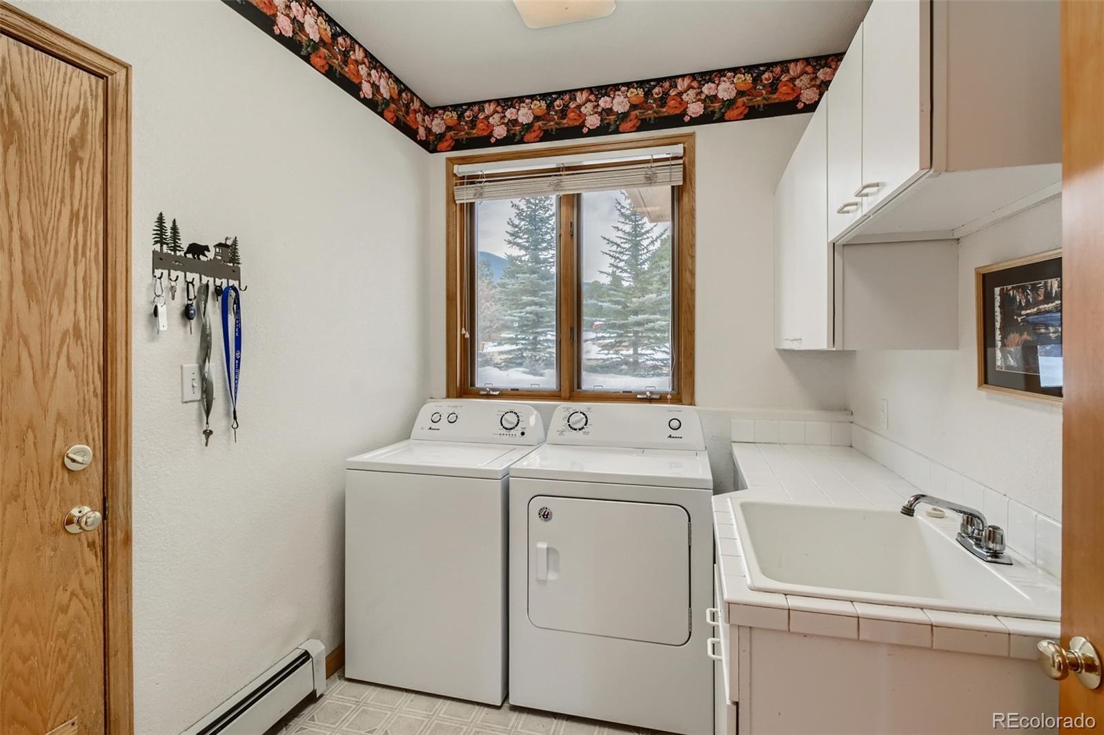 1634 Muirfield Lane Evergreen, CO 80439 - Photo 21 of 40 a utility room with dryer and washer