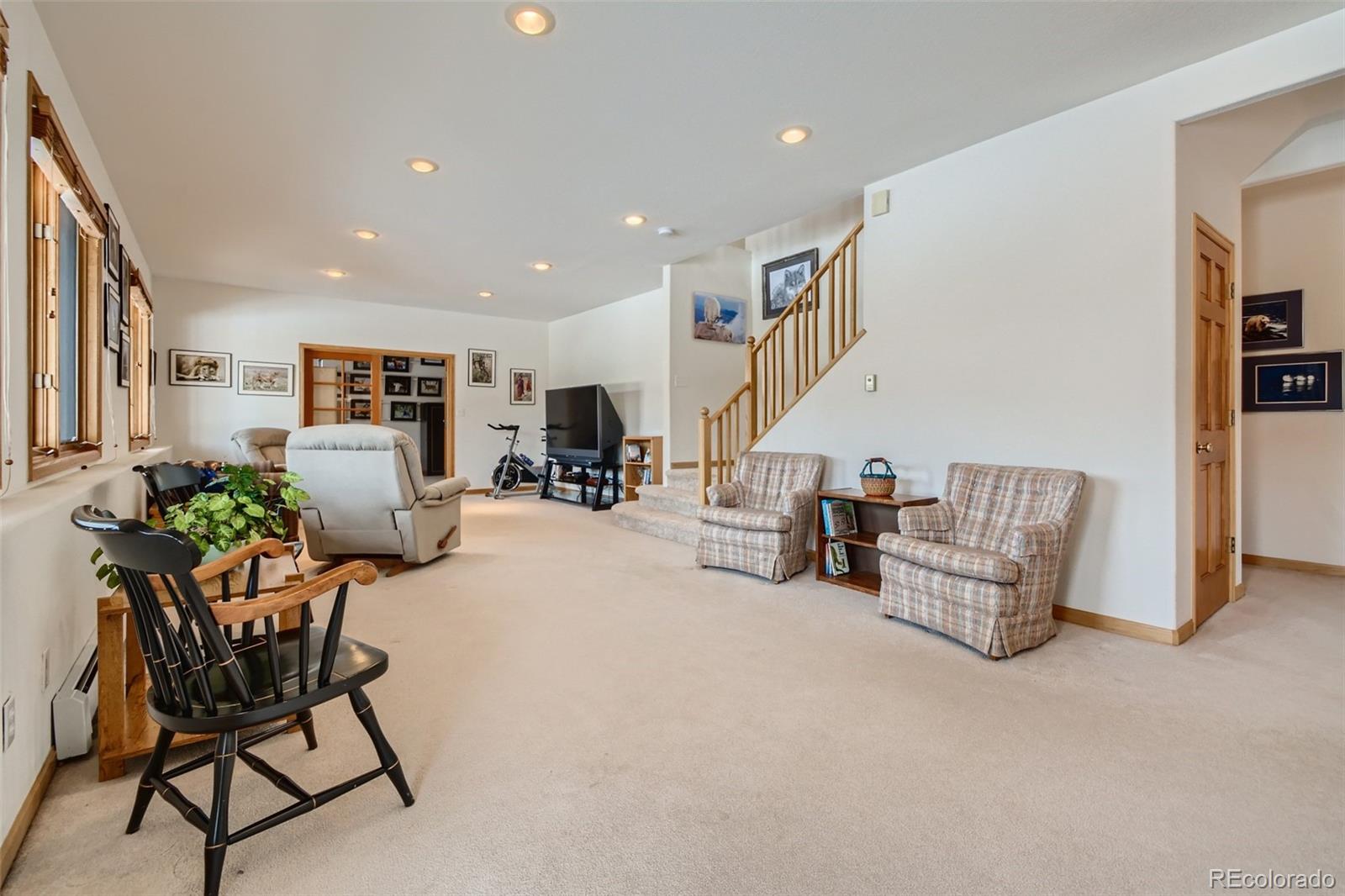 1634 Muirfield Lane Evergreen, CO 80439 - Photo 23 of 40 a living room with furniture and kitchen view