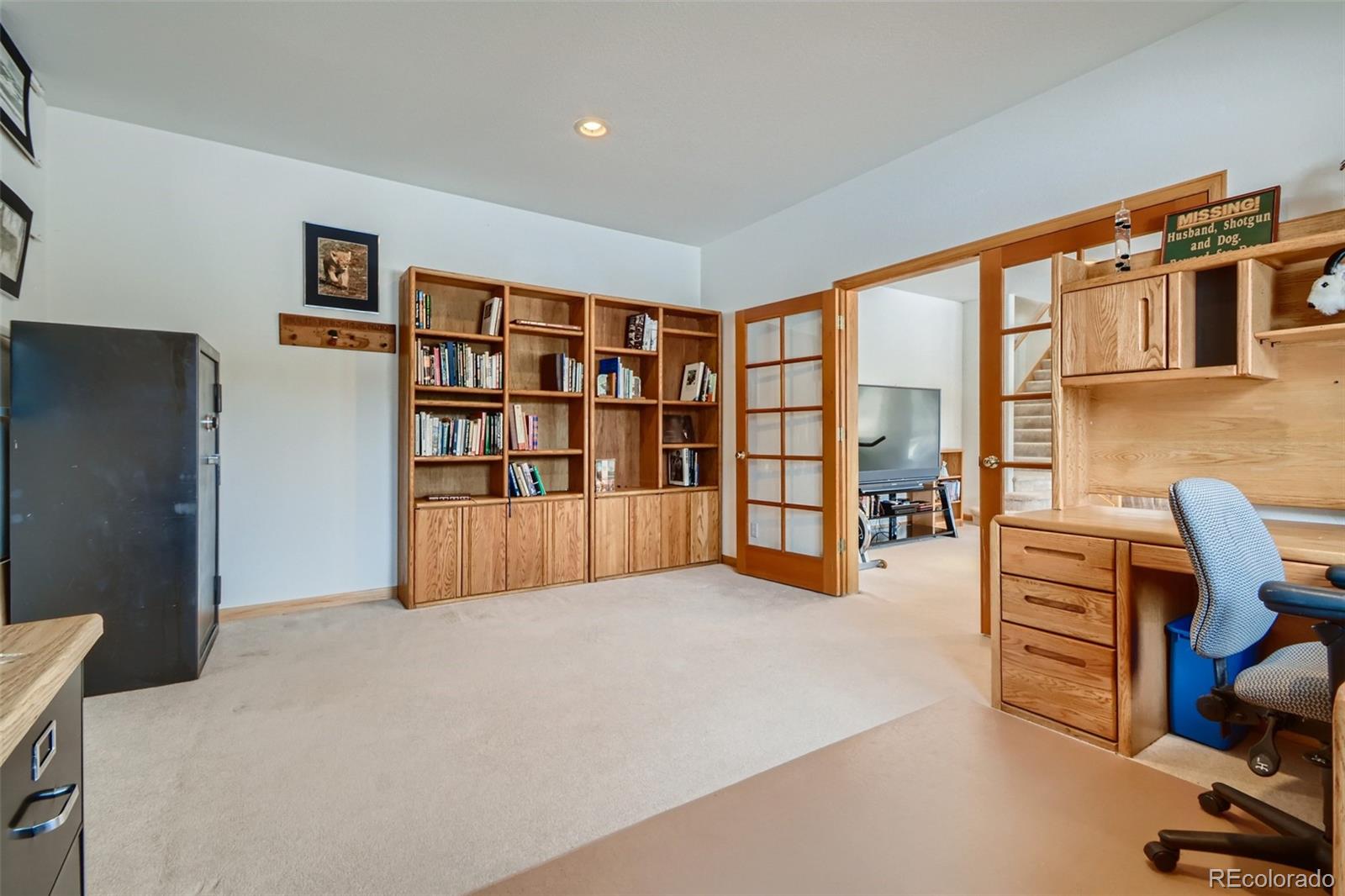 1634 Muirfield Lane Evergreen, CO 80439 - Photo 28 of 40 a furnished livingroom with a large window and a couch