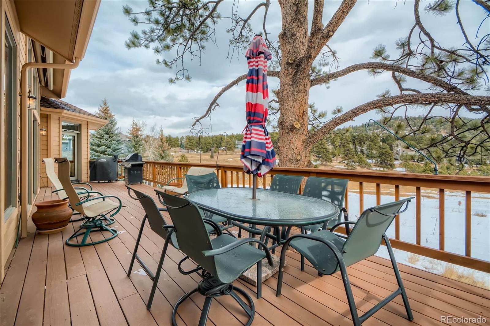 1634 Muirfield Lane Evergreen, CO 80439 - Photo 31 of 40 a view of a chairs and table in the patio