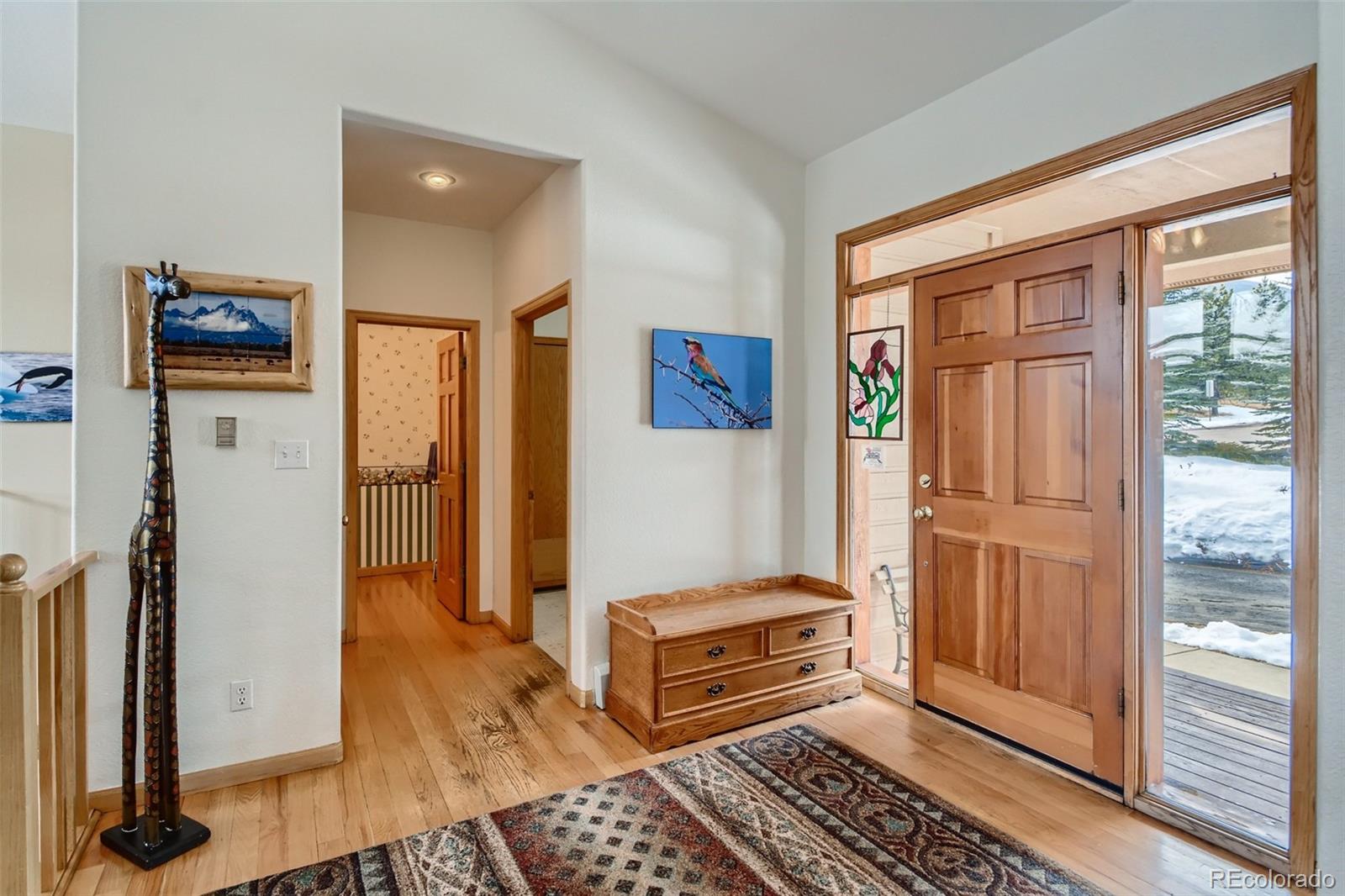 1634 Muirfield Lane Evergreen, CO 80439 - Photo 5 of 40 a view of a hallway with a livingroom and a window