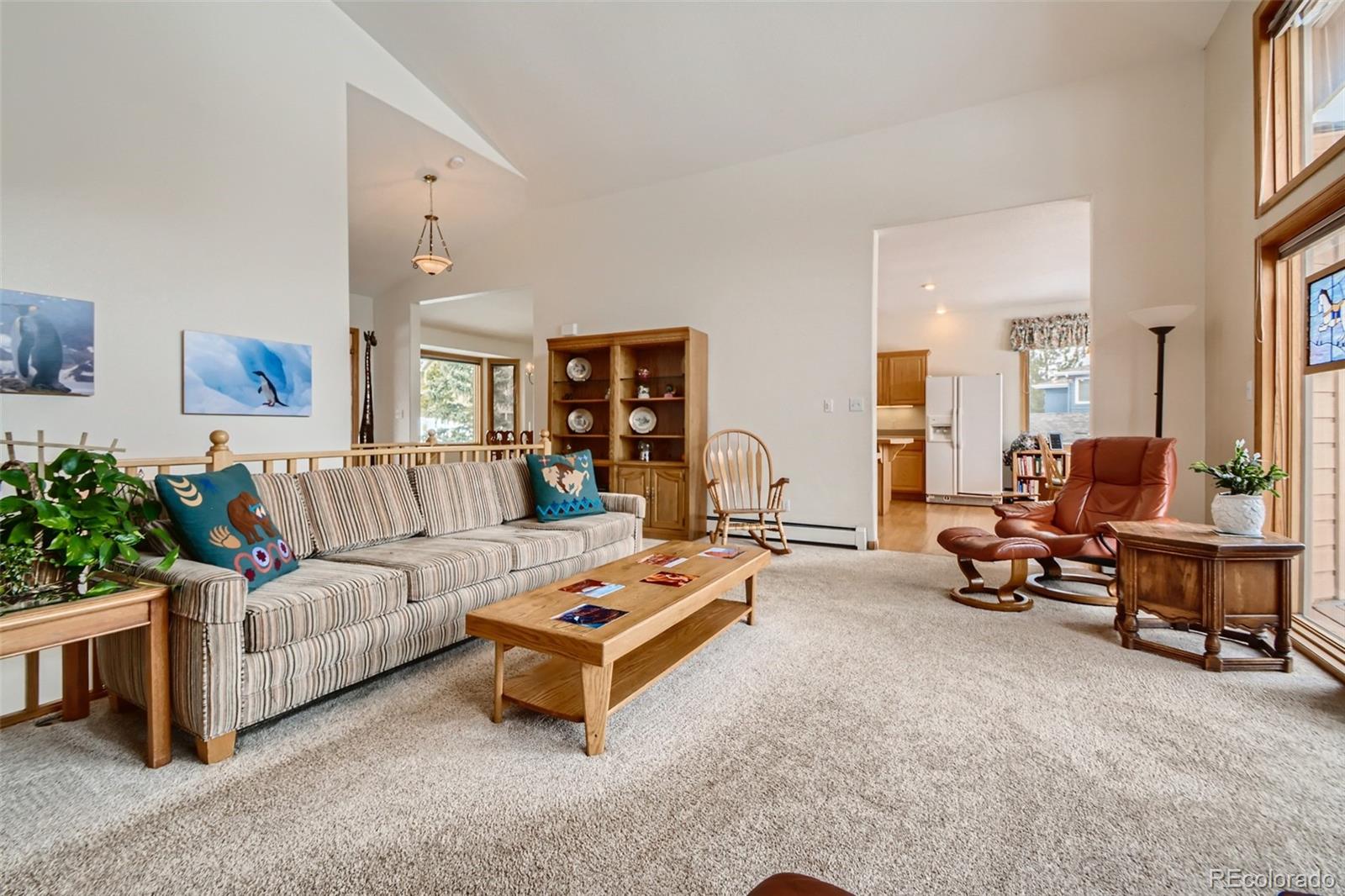 1634 Muirfield Lane Evergreen, CO 80439 - Photo 8 of 40 a living room with furniture and a large window