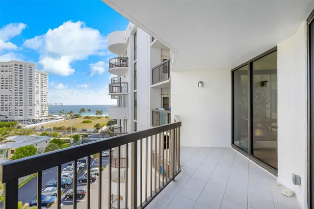 a view of balcony with furniture