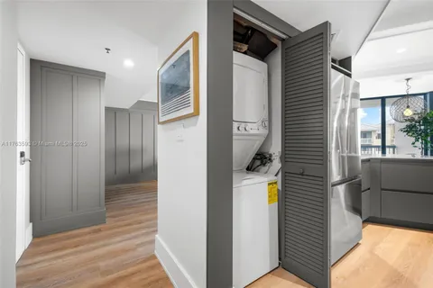 a view of hallway with wooden floor and staircase