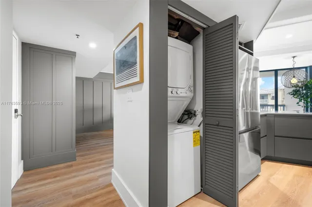 a view of hallway with wooden floor and staircase
