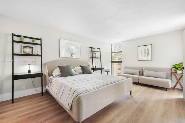 a bedroom with a bed and a couch