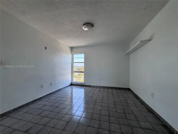 a view of an empty room and window