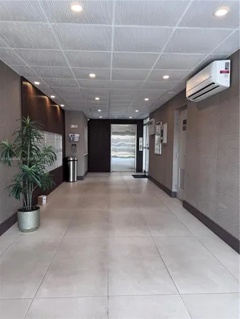 a view of a hallway with potted plant