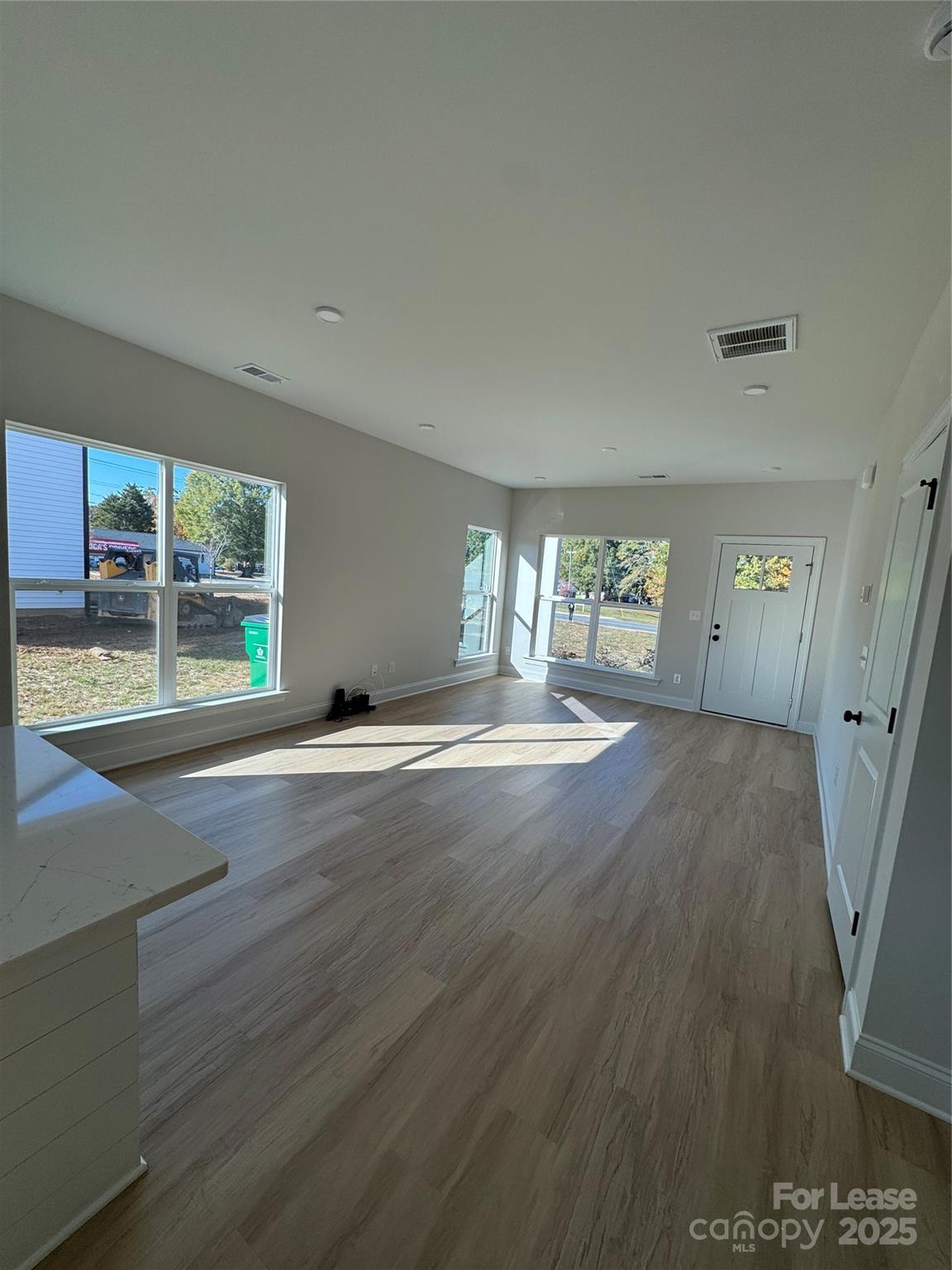 2157 Tom Sadler Road Charlotte, NC 28214 - Photo 4 of 13 wooden floor in an empty room with a window