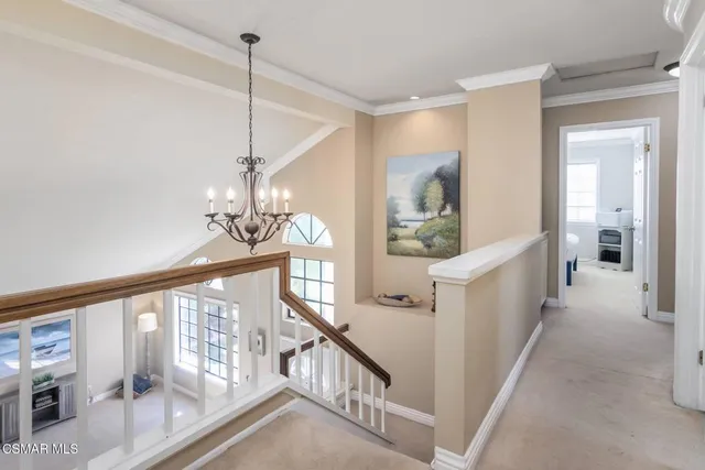 a view of a hallway view with staircase