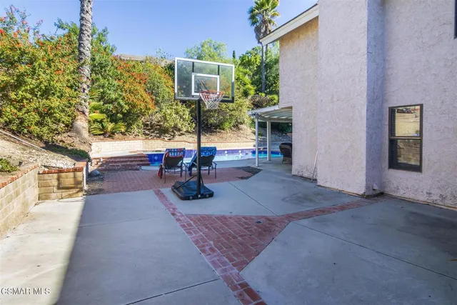 a view of a swimming pool with a yard