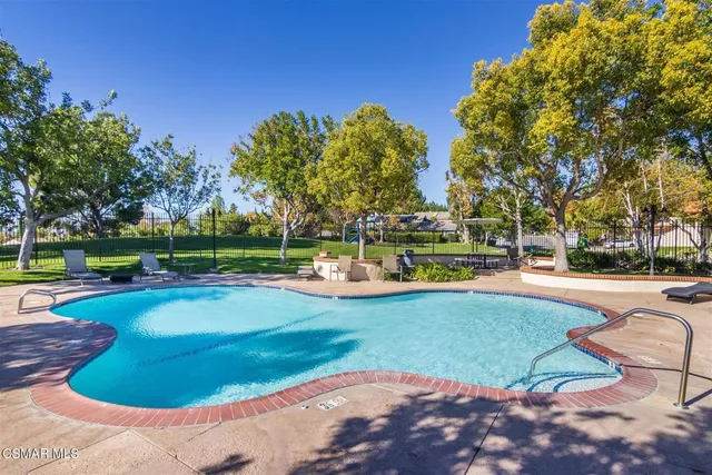 a table and chairs sitting in the garden