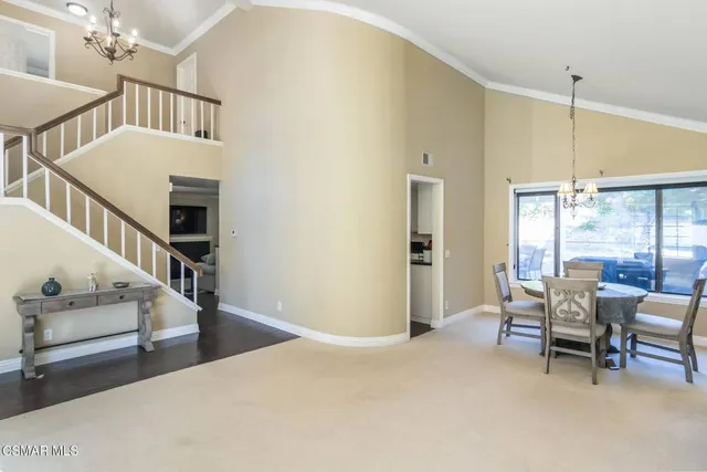 a view of a livingroom with furniture and windows