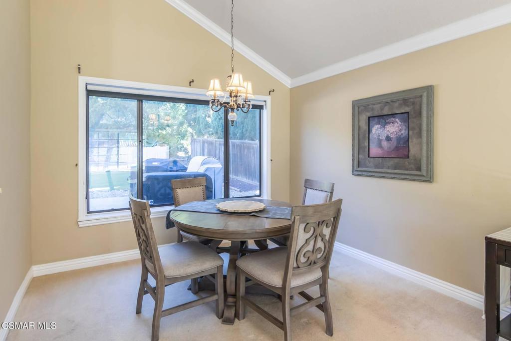 2594 Ridgebrook Place Thousand Oaks, CA 91362 - Photo 5 of 26 a dining room with furniture a chandelier and wooden floor
