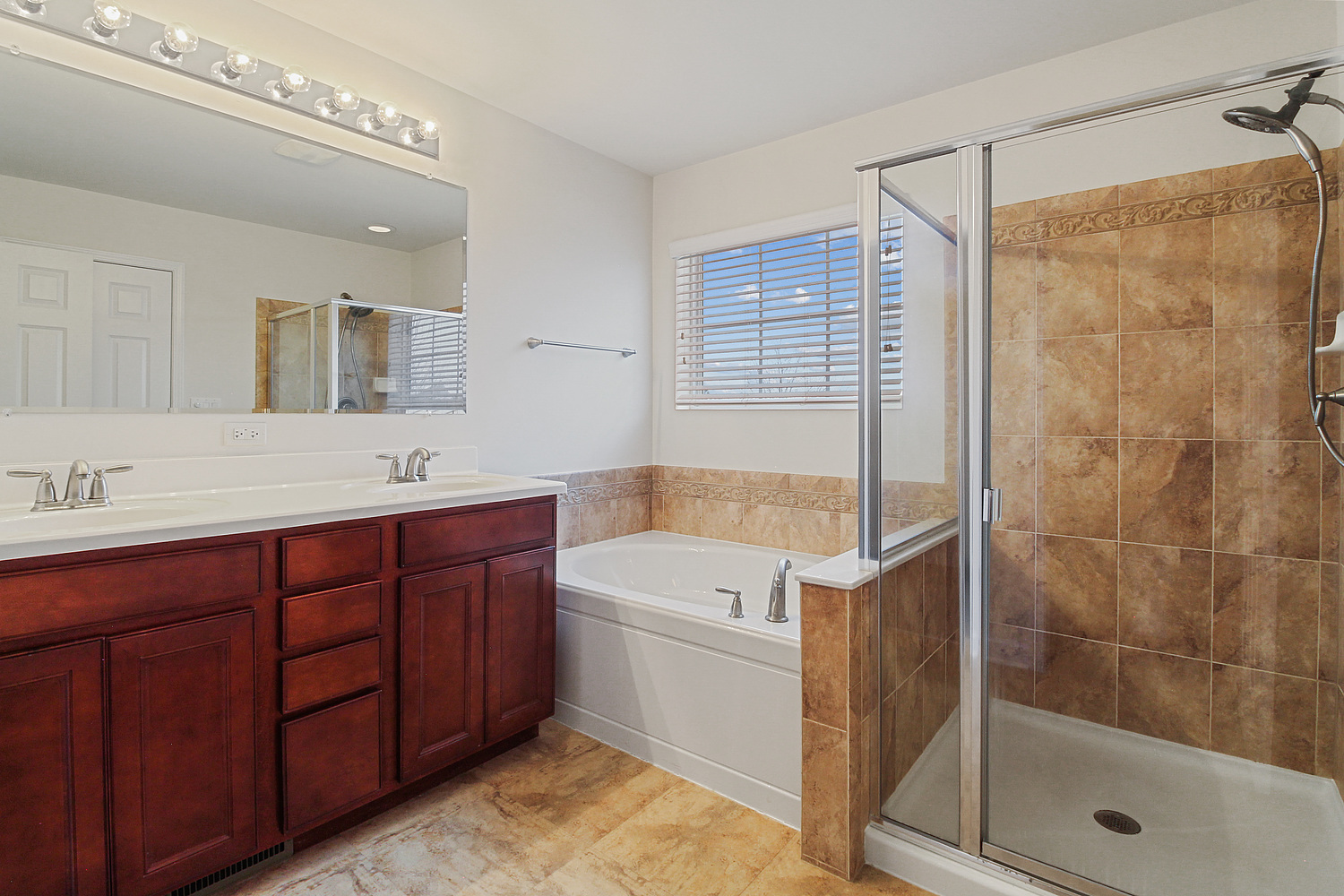 427 Azalea Street Elgin, IL 60124 - Photo 25 of 28 a bathroom with a tub sink shower and mirror