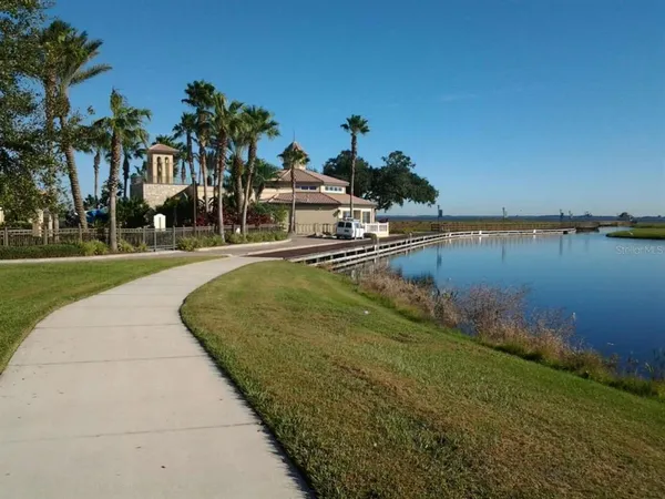 a view of a lake with a house in the background