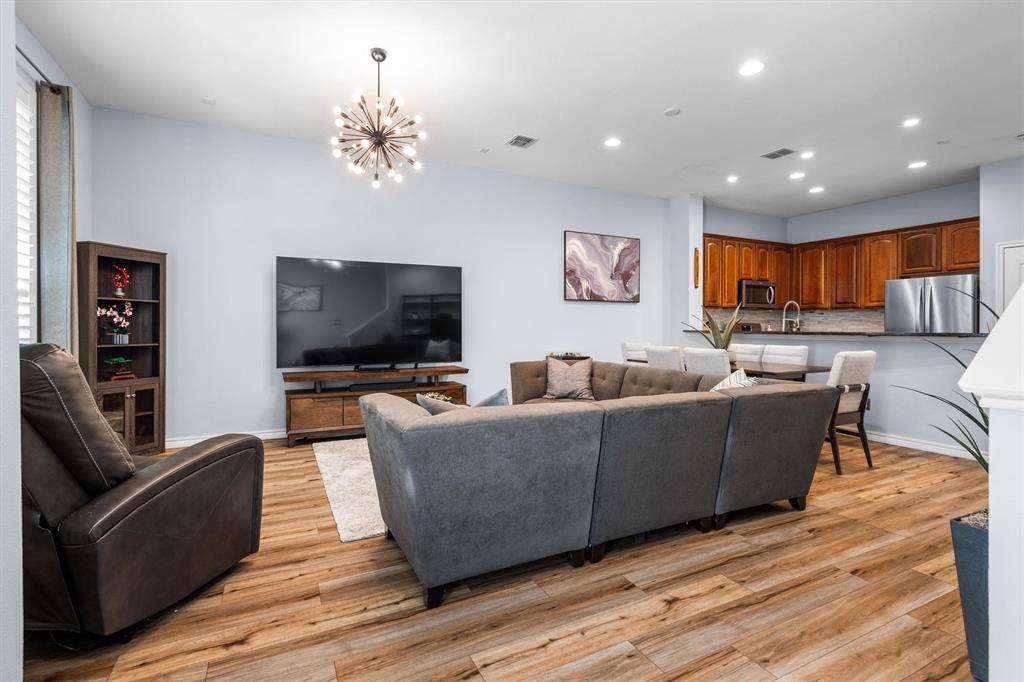 5019 Morris Avenue, Unit 22 Addison, TX 75001 - Photo 15 of 31 a living room with furniture and a flat screen tv