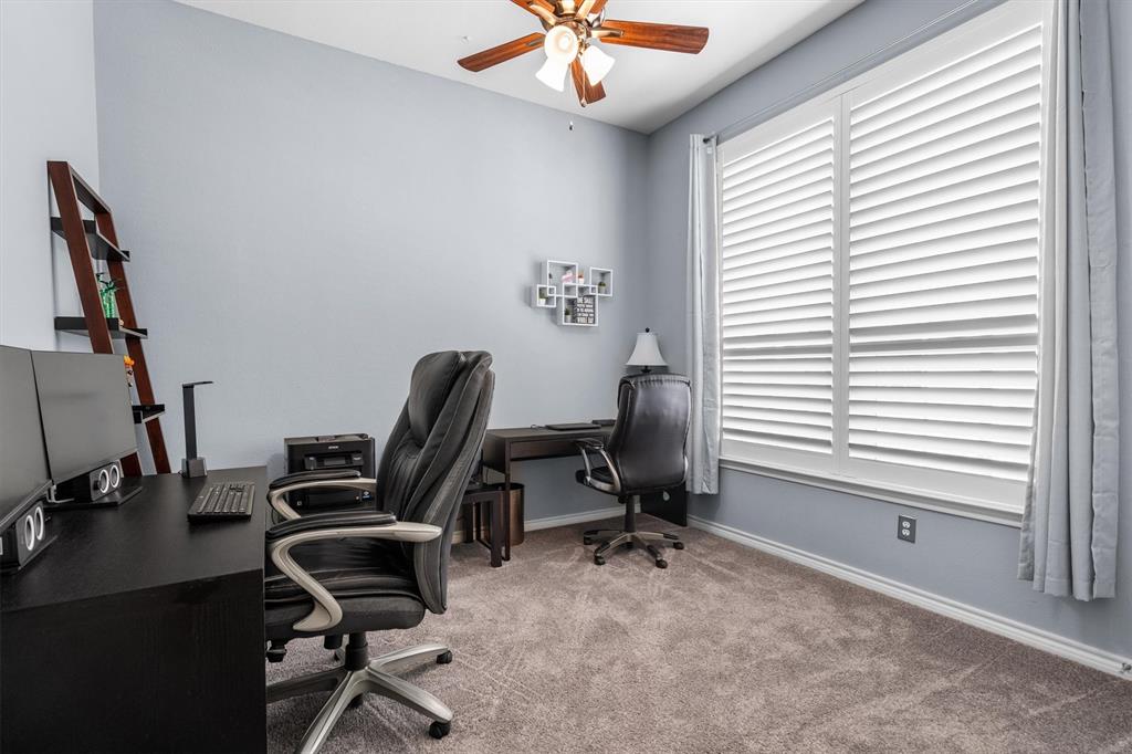 5019 Morris Avenue, Unit 22 Addison, TX 75001 - Photo 16 of 31 a view of a workspace with furniture and a window
