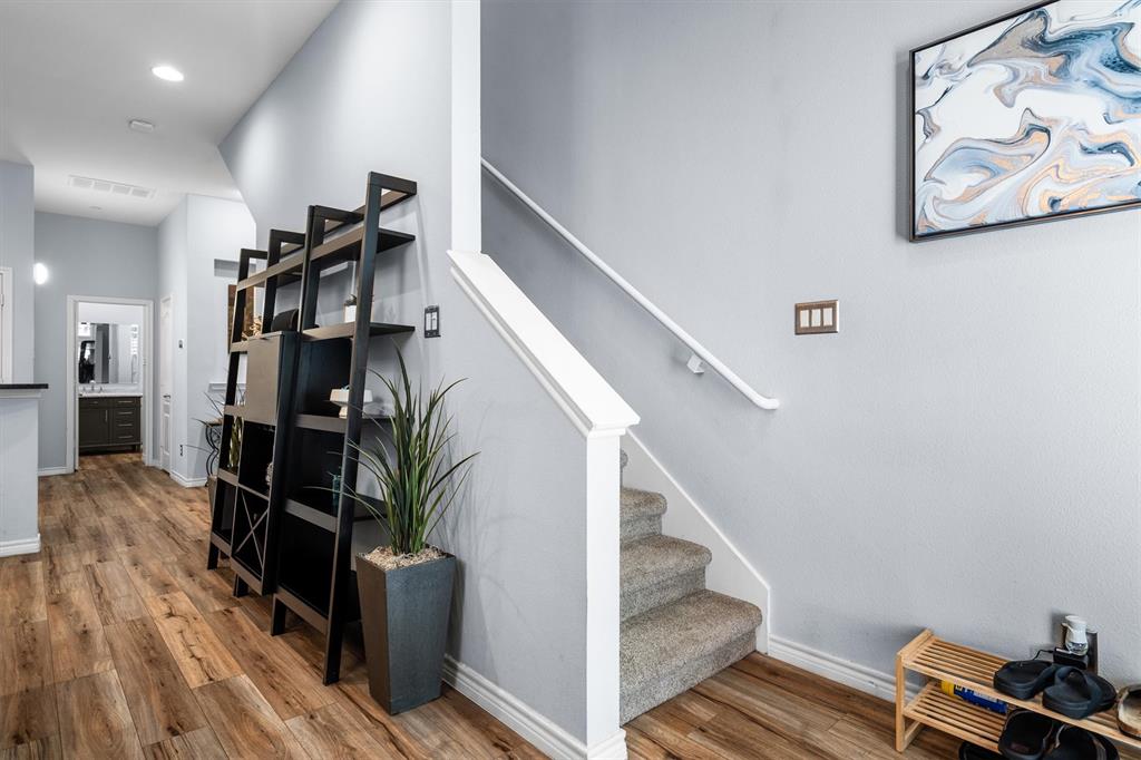 5019 Morris Avenue, Unit 22 Addison, TX 75001 - Photo 18 of 31 a view of entryway and hall with wooden floor