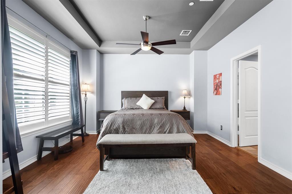 5019 Morris Avenue, Unit 22 Addison, TX 75001 - Photo 20 of 31 a bedroom with a bed rug and window