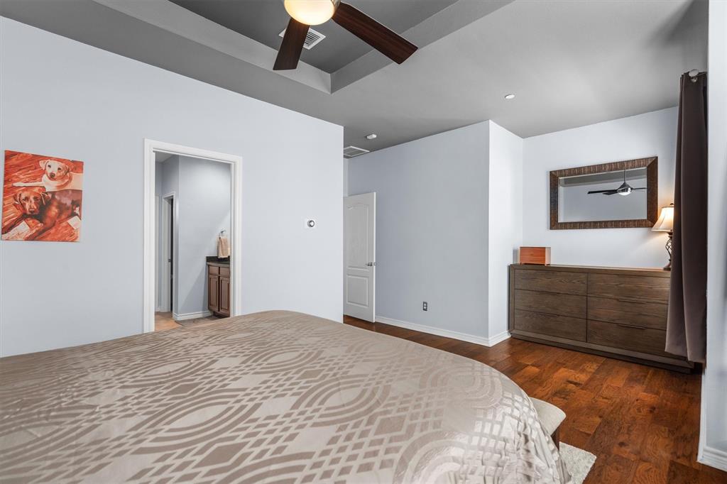 5019 Morris Avenue, Unit 22 Addison, TX 75001 - Photo 22 of 31 a bedroom with a bed and a dresser