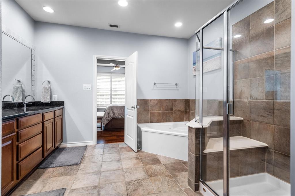 5019 Morris Avenue, Unit 22 Addison, TX 75001 - Photo 23 of 31 a bathroom with a glass shower door