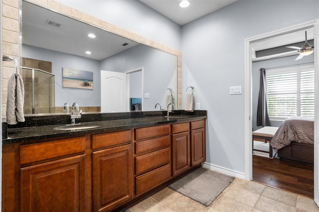 5019 Morris Avenue, Unit 22 Addison, TX 75001 - Photo 24 of 31 a bathroom with double vanity and a mirror