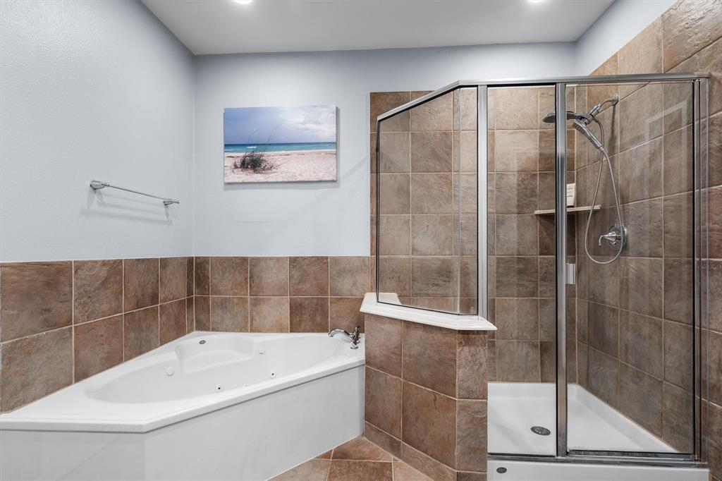 5019 Morris Avenue, Unit 22 Addison, TX 75001 - Photo 25 of 31 a bathroom with a bathtub and a shower