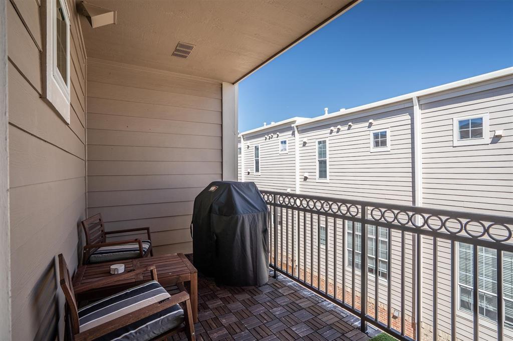 5019 Morris Avenue, Unit 22 Addison, TX 75001 - Photo 28 of 31 a view of a balcony with a chair
