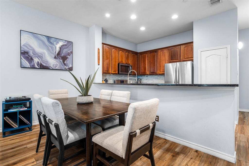 5019 Morris Avenue, Unit 22 Addison, TX 75001 - Photo 8 of 31 a view of a dining room with furniture