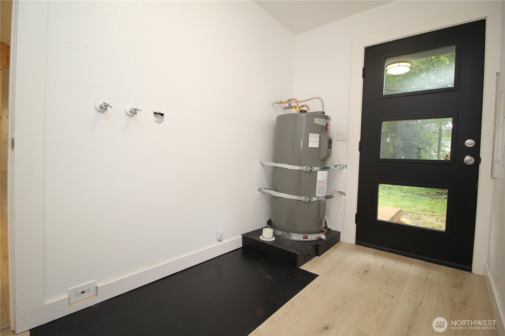 10341 184th Avenue Southwest Rochester, WA 98579 - Photo 22 of 36 a room with a wooden floor and staircase