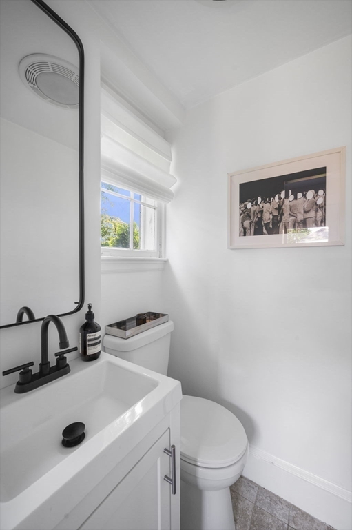 5 Chesterlee Lane Swampscott, MA 01907 - Photo 20 of 42 a bathroom with a sink a toilet and mirror