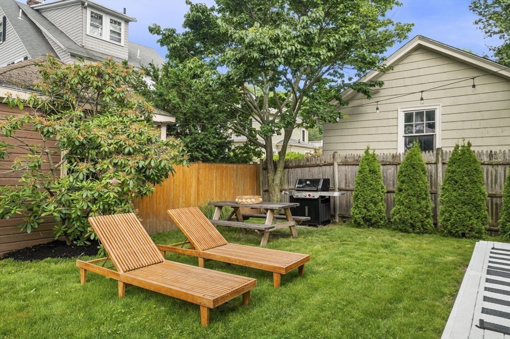 5 Chesterlee Lane Swampscott, MA 01907 - Photo 37 of 42 a view of a chair and table in backyard of the house