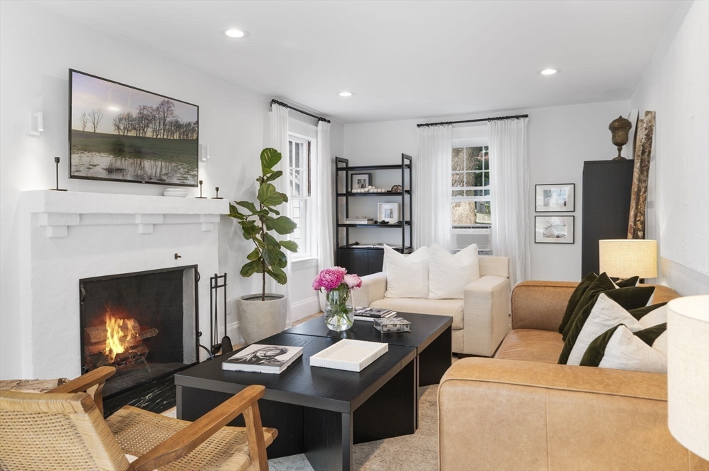 5 Chesterlee Lane Swampscott, MA 01907 - Photo 5 of 42 a living room with furniture a flat screen tv and a fireplace