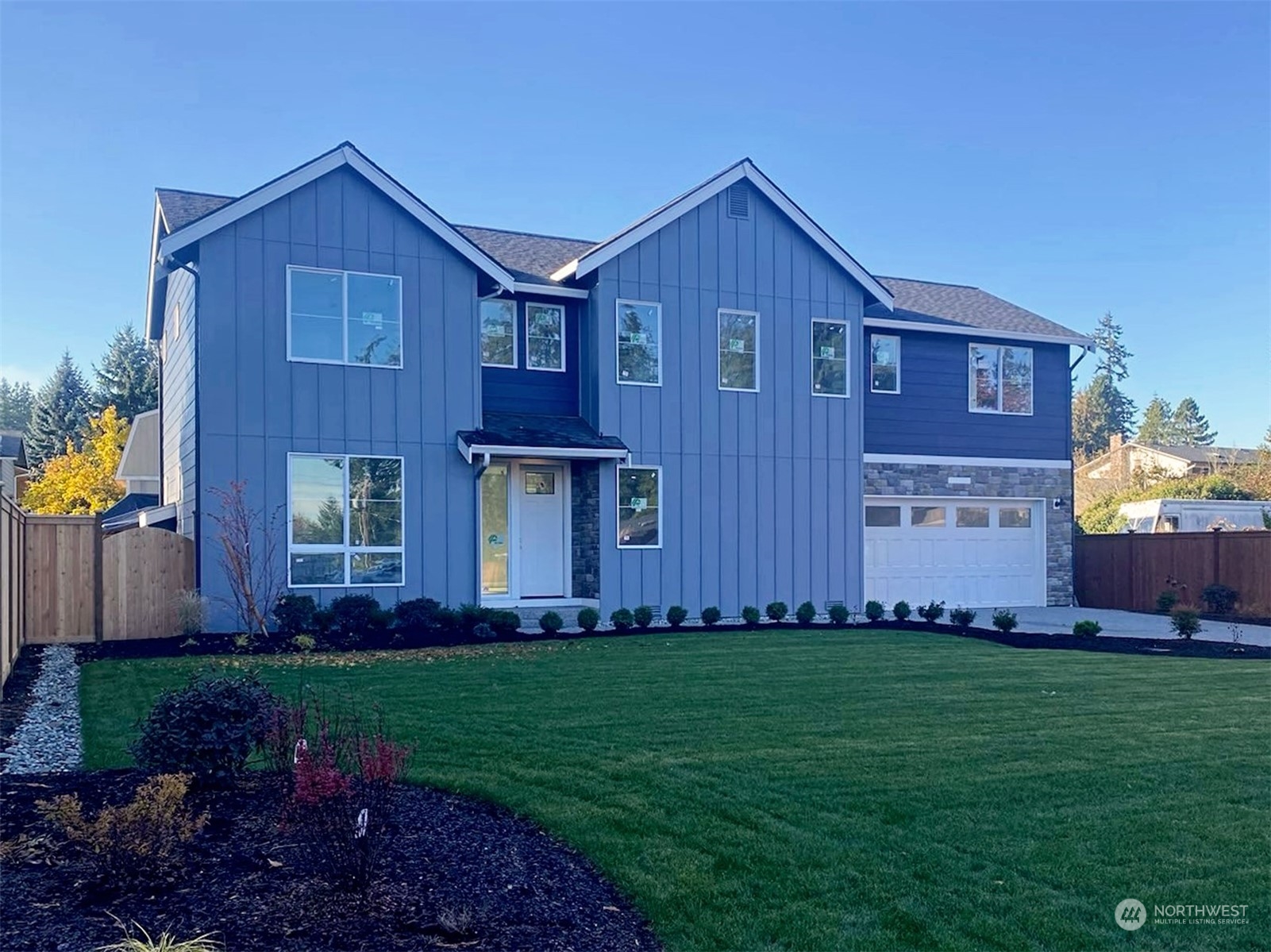 22522 Meridian Avenue South Bothell, WA 98021 - Photo 1 of 1 a front view of a house with a garden