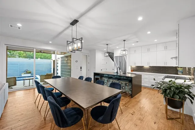 a kitchen with a table and chairs in it