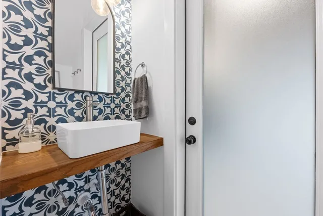 a bathroom with a bathtub and shower