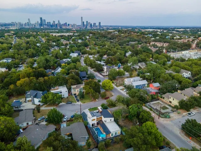 an aerial view of a city with lots of residential buildings