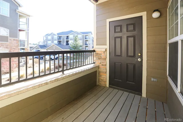 a view of a balcony with wooden floor