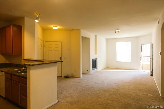 a view of a kitchen with wooden floor